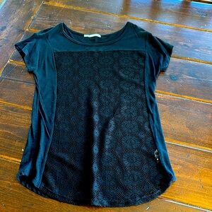 Maurice’s black shirt